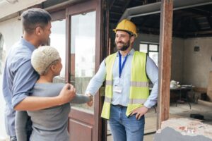 Contractor shaking hands with tenants